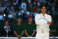 Roger Federer of Switzerland holds his runners-up trophy after losing the men's singles Final match against Rafael Nadal of Spain on day thirteen of the Wimbledon Lawn Tennis Championships at the All England Lawn Tennis and Croquet Club on July 6, 2008 in London, England. (Photo by Clive Brunskill/Getty Images)